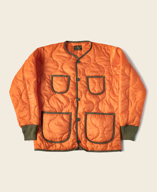 Orange quilted padded ripstop nylon jacket with button front and four flap pockets