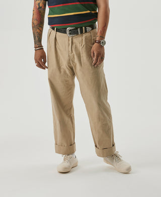 Khaki chino trousers with double pleats, belt loops, and cuffed hems