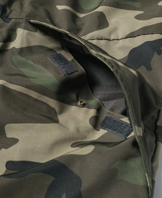 Camo parka collar with snap closure and textured loop patch detail