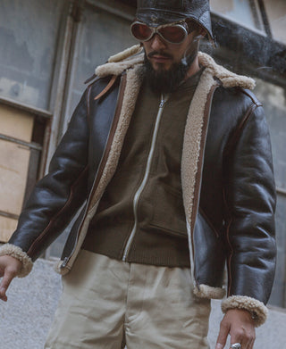 Dark brown flight jacket with tan shearling hood-style collar and cuffs, zip front
