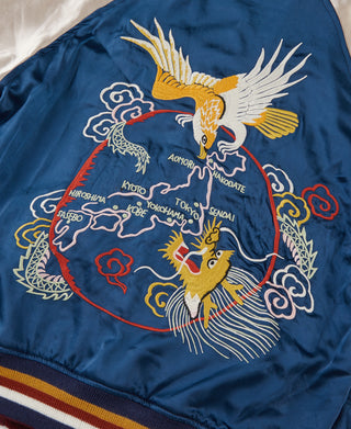 Blue reversible souvenir jacket with large embroidered dragon, tiger, and cloud motifs