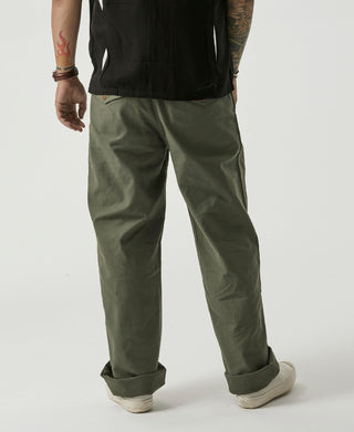 Olive Gurkha bermuda pants, side view with tapered legs and cuffed hems
