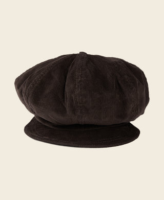 Dark brown corduroy newsboy cap with curved brim and visible panel stitching