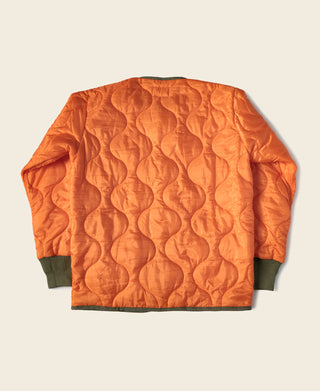 Orange quilted padded ripstop nylon jacket back view with ribbed hem cuffs