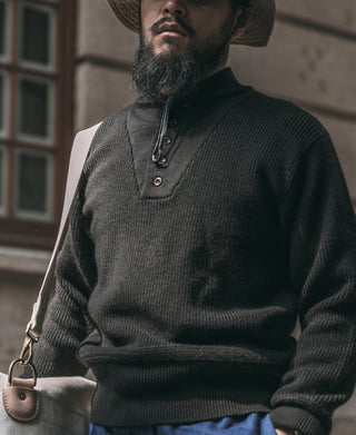Black wool high-neck sweater with short button placket and ribbed hem and cuffs