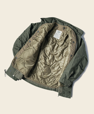 Olive quilted field jacket liner, open front showing inner lining and label