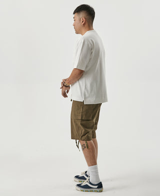 White cotton crew-neck T-shirt, side view with straight hem and short sleeves