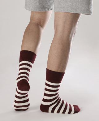 Pair of retro striped cotton socks on model, burgundy and white stripes