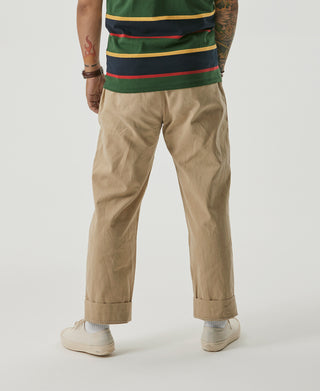 Khaki chino trousers with double pleats and cuffed ankle length hems