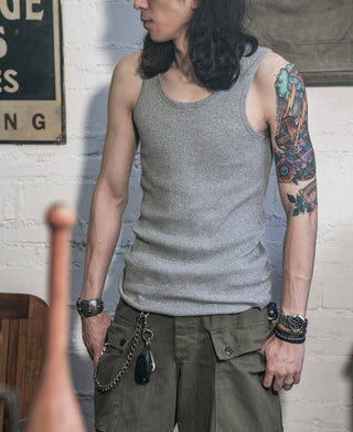 Gray cotton tank top on model, sleeveless crew neck