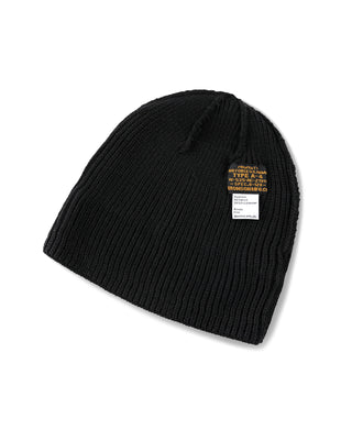 Black knit watch cap with small woven label on side