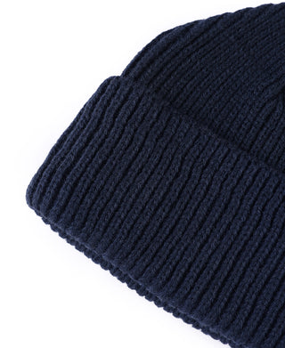 Navy knit watch cap beanie with rectangular cuff label