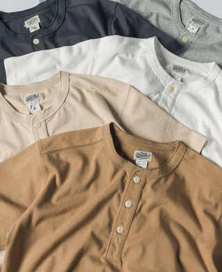 Assorted cotton henley T-shirts with button plackets and short sleeves in white and dark colors