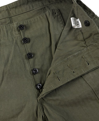 Olive cargo shorts with dark buttons, flap pocket, and visible stitching