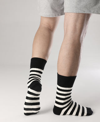Pair of black and white striped crew cotton socks with ribbed cuffs and toes
