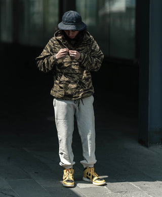Light gray sweatpants with drawstring waist and relaxed tapered legs