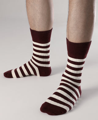 Retro striped cotton socks on feet, burgundy and white stripes, cushioned toe