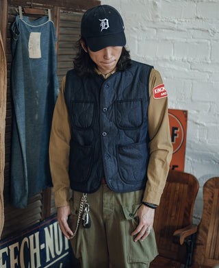 Navy quilted denim vest with button-front and front flap pockets