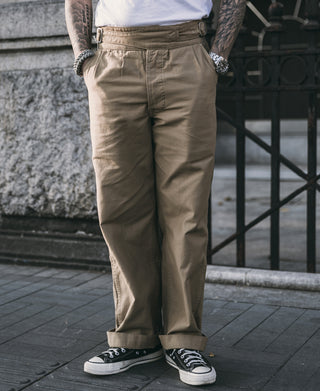 Khaki bermuda pants with pleated front and cargo-style side pockets