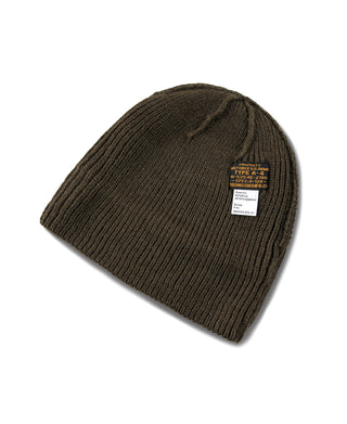 Olive knit watch cap with label tag on folded brim
