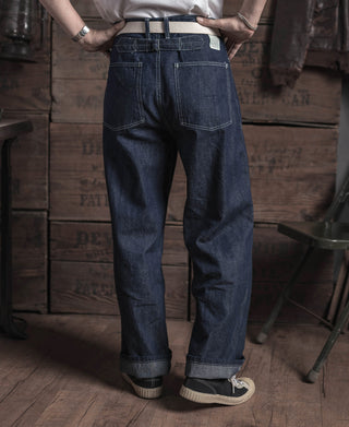 Indigo denim fatigue dungaree pants with front seams and rolled cuffs