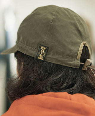 Olive cap back view with fabric patch and adjustable drawcord