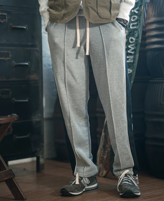 Gray straight-leg sweatpants with side stripes and drawstring waist