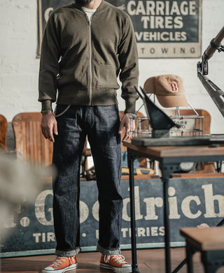 Olive wool zip-up sweater with full front zipper and ribbed cuffs