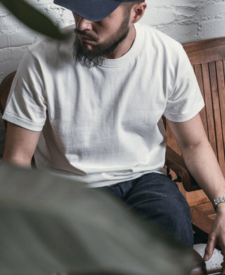 White crew-neck athletic t-shirt with short sleeves and smooth fabric drape
