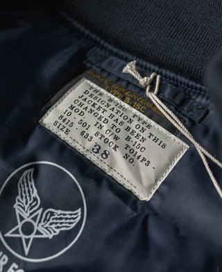Navy jacket label at inside collar with rib knit trim and stitching