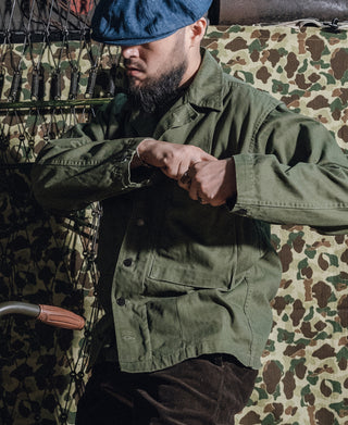 Olive green HBT jacket detail on chest pocket flap and button placket