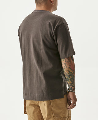 Dark gray cotton pocket T-shirt, crew neck, back side view on a man