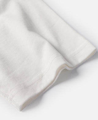 White cotton henley T-shirt sleeve and hem stitching, close-up