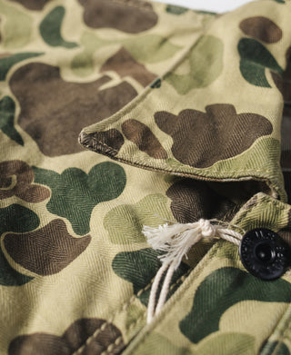 Camouflage jacket cuff with snap buttons and drawstring detail