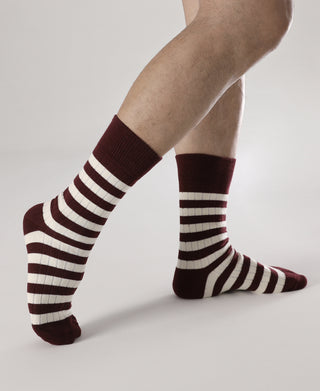 Retro striped cotton socks on legs, burgundy and white horizontal stripes