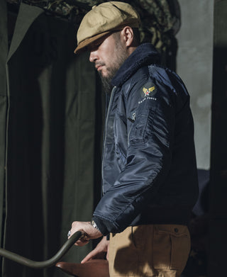 Navy B-15C flight jacket on model, side profile with fur collar and zip front