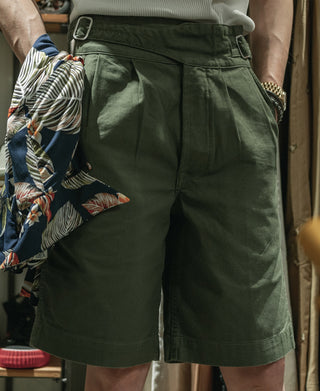 Olive bermuda shorts back view with belt loops and pleated detailing