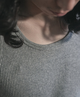 Close-up of gray ribbed cotton tank top neckline and collar