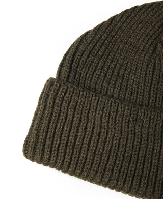 Olive knit watch cap close-up of ribbed fabric and brim edge