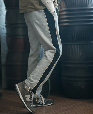 Gray straight-leg sweatpants with side stripe tape and drawstring waist