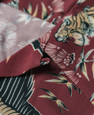 Wine red aloha shirt placket close-up with camp collar and tiger-crane print
