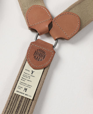 Leather Y-back center connector and stitched tabs on khaki striped suspenders