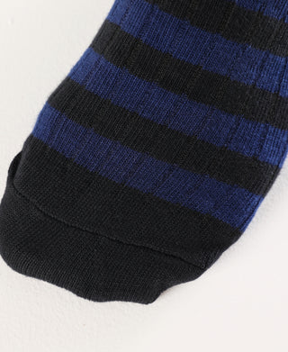 Black cotton sock toe with blue and dark horizontal stripes