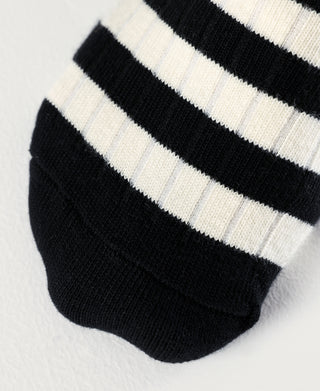 Black and white striped crew cotton socks, close-up of toe and knit texture