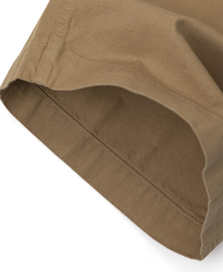 Khaki bermuda shorts leg with curved opening and double-stitched hem