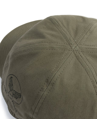 Olive A-3 flight cap close-up of side emblem and diamond-pattern stitching