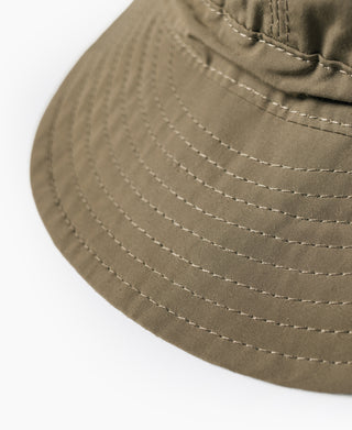 Olive nylon cap brim with detailed stitching and textured weave