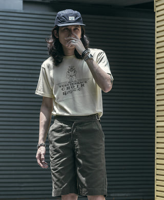 Navy 5-panel cotton cap worn on a person, featuring front logo patch and brim