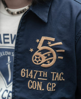 Navy tour jacket close-up of embroidered “6147th TAG. CON. GP” badge on chest