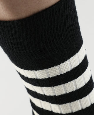 Black and white striped crew cotton socks, close-up of ribbed cuff and leg stripes